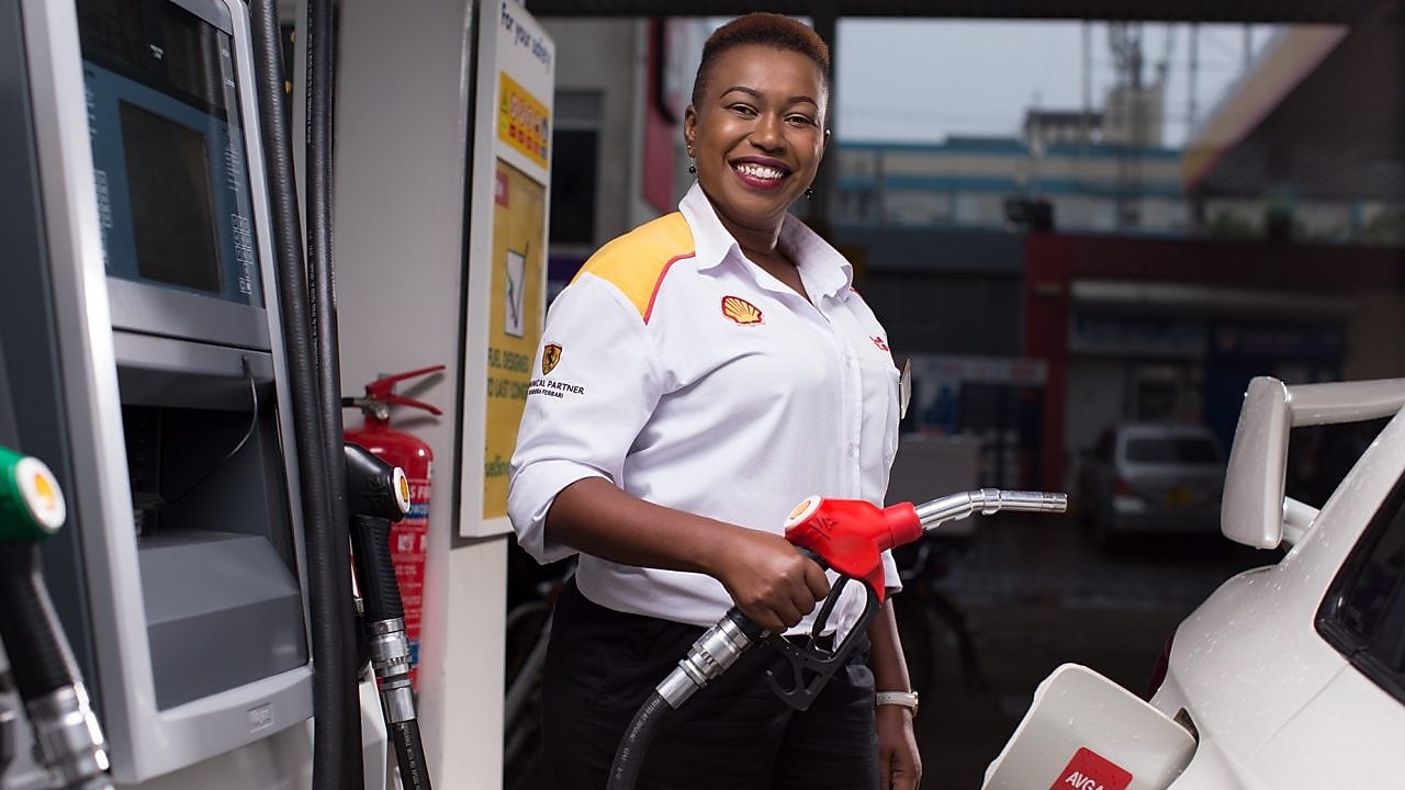 Man refueling his car at a petrol pump