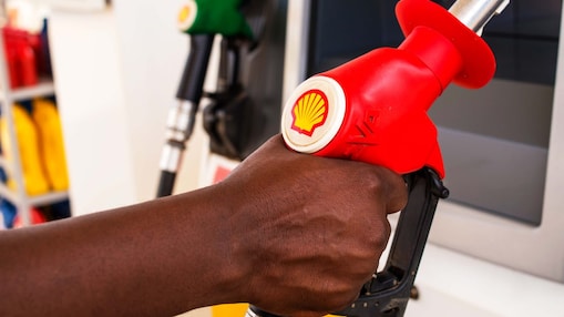 Service attendant holding a fuel nozzle