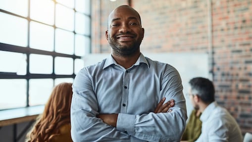 A smiling man in a business shirt