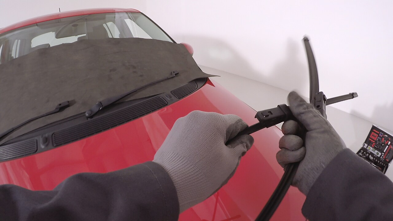 hands holding car wipers