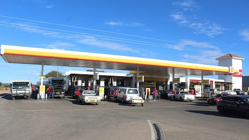 Cars on a shell forecourt in Botswana