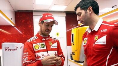 Sebastian Vettel and a Ferrari scientist inside a Shell lab