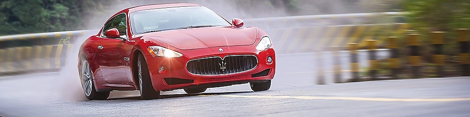 A red Maserati speeds uphill in the Shell Helix Ultra film We Know Why You Drive
