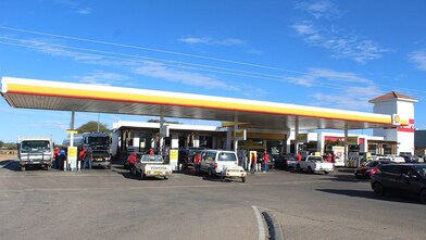 Cars on a shell forecourt in Botswana