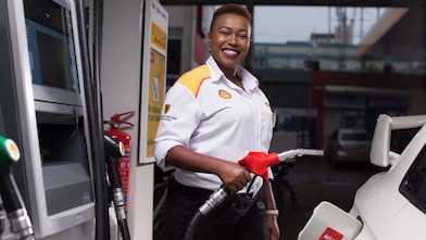 Man refueling his car at a petrol pump