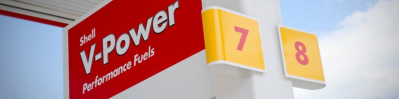 Car travelling along a road at night